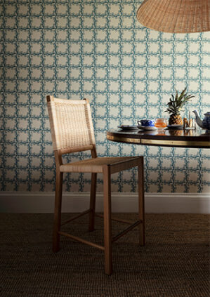 The Rattan Loggia Counter Height Stool: lifestyle