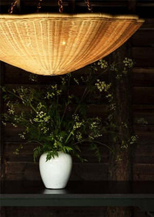 The Rattan Daisy Hanging Light - Large With Chain: lifestyle