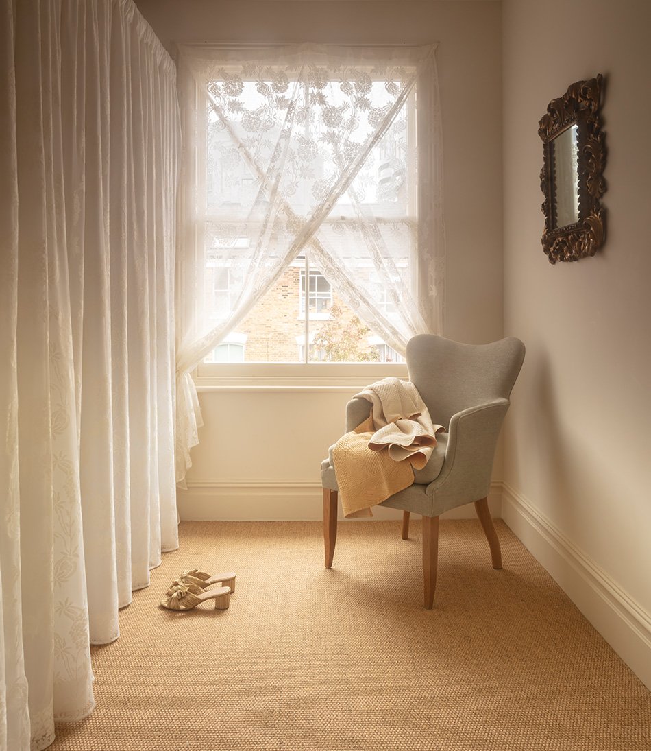 Hortense Lace as a curtain behind a pale blue armchair