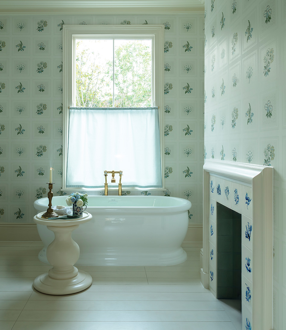 Linnaeus Original Wallpaper in bathroom with a bathtub table and candle
