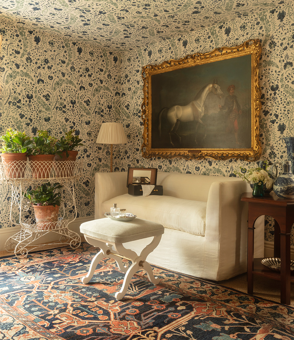Mole Celadon upholstered stool in front white sofa an large oil painting