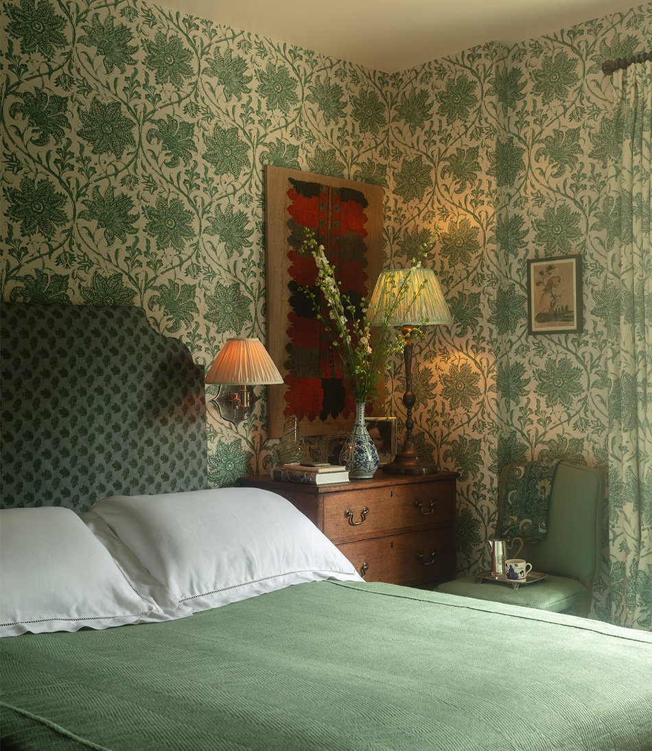 Palampore Blossom Emerald in a bedroom with green bed