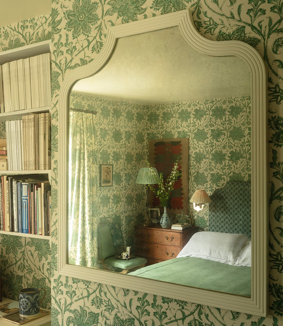 Palampore Blossom Emerald in a bedroom with green bed