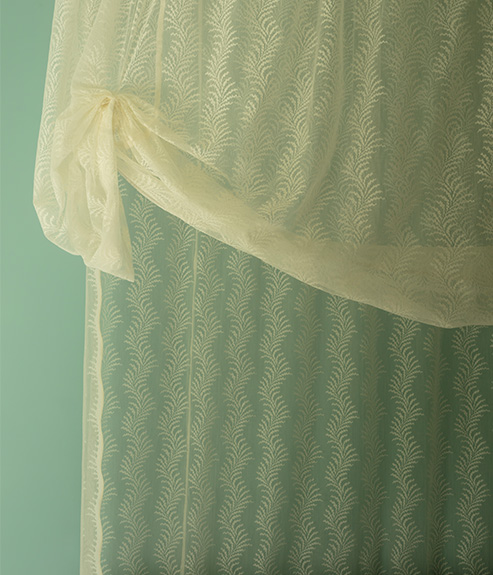Scrolling Fern Silhouette Lace as a bed curtain
