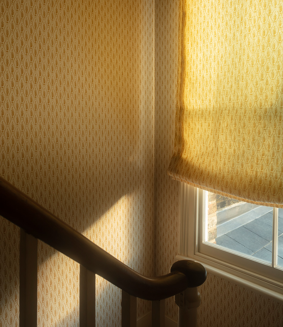 Serpentine Fern Ochre with a matching blind in a stairway