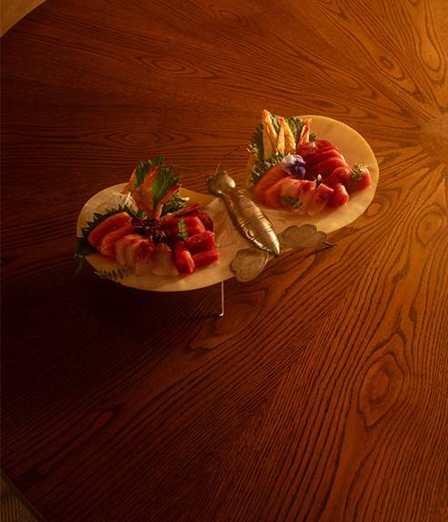 The Gambado table with a plate of sushi 