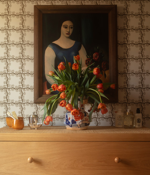 The Rattan Templeton Chest with geometric brown wallpaper 