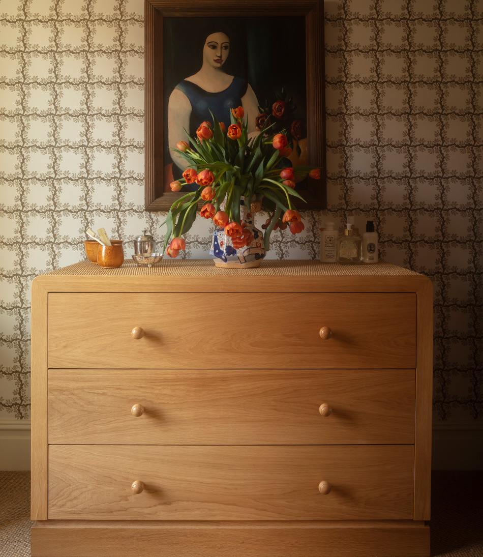 The Rattan Templeton Chest with geometric brown wallpaper 